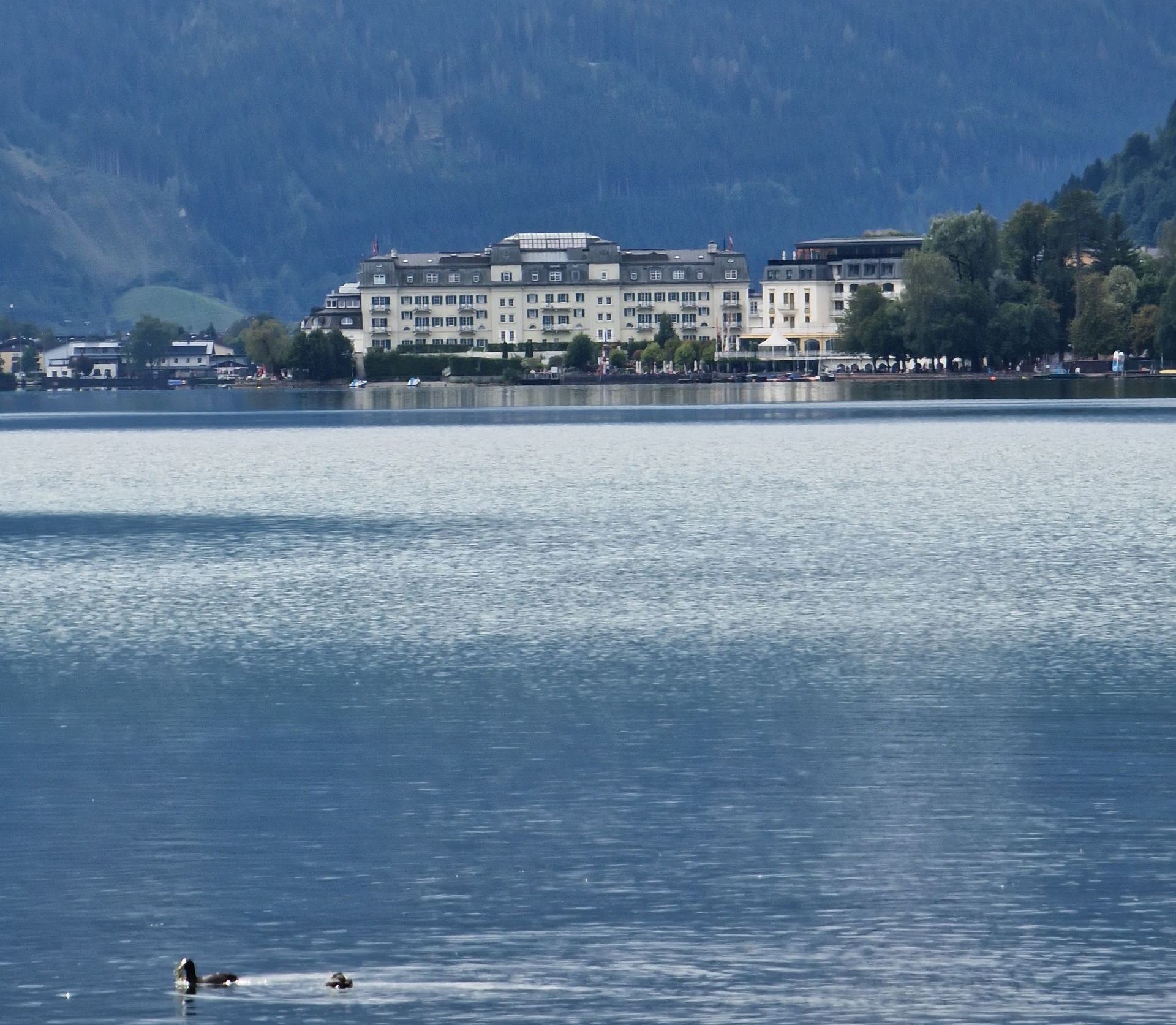 A hotel in front of a lake